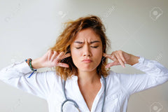 articles/91021683-irritated-female-doctor-plugging-ears-with-fingers.jpg